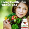 woman with bare shoulders holding vegetable